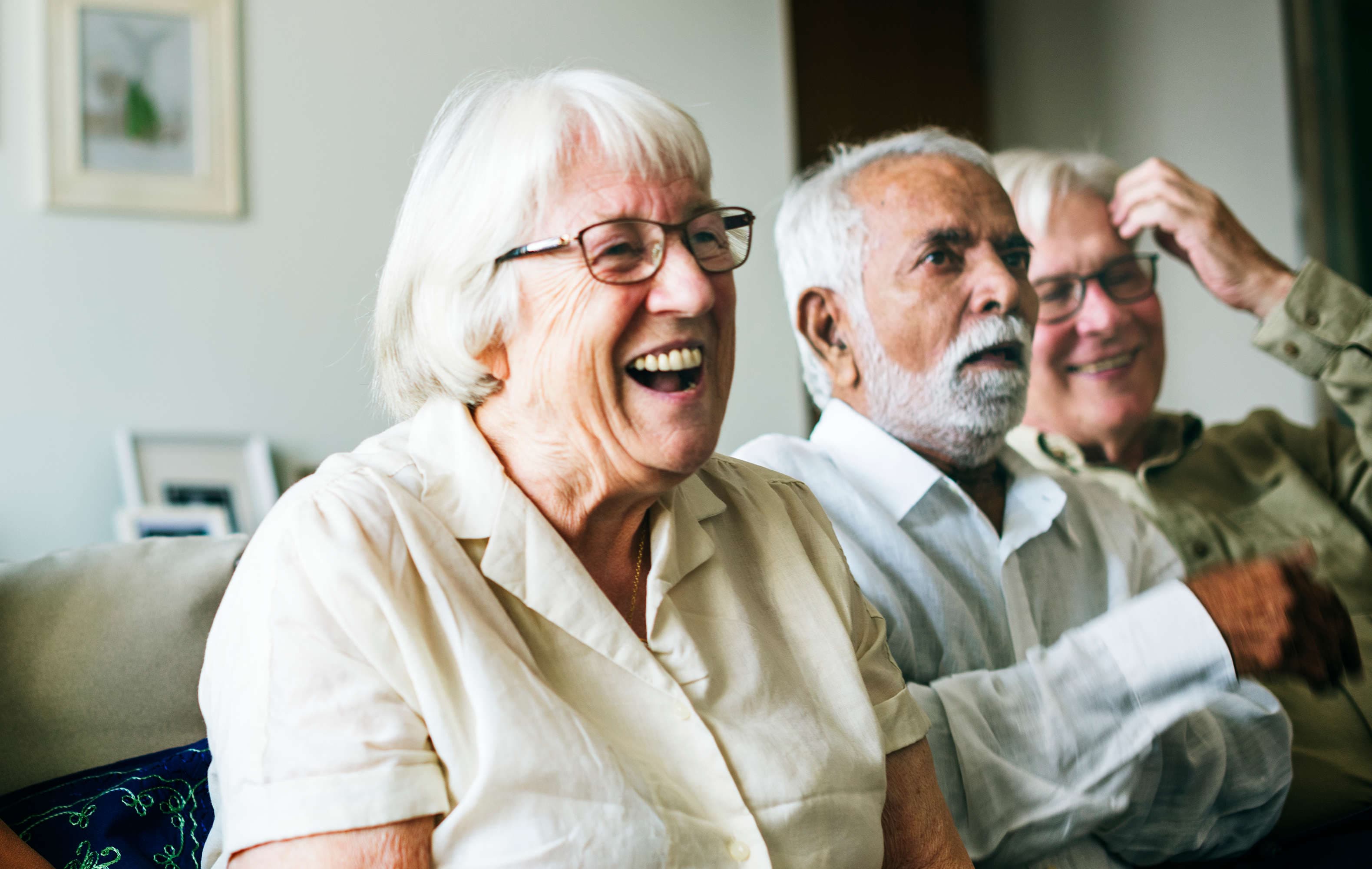 Image of a group of older people laughing together.