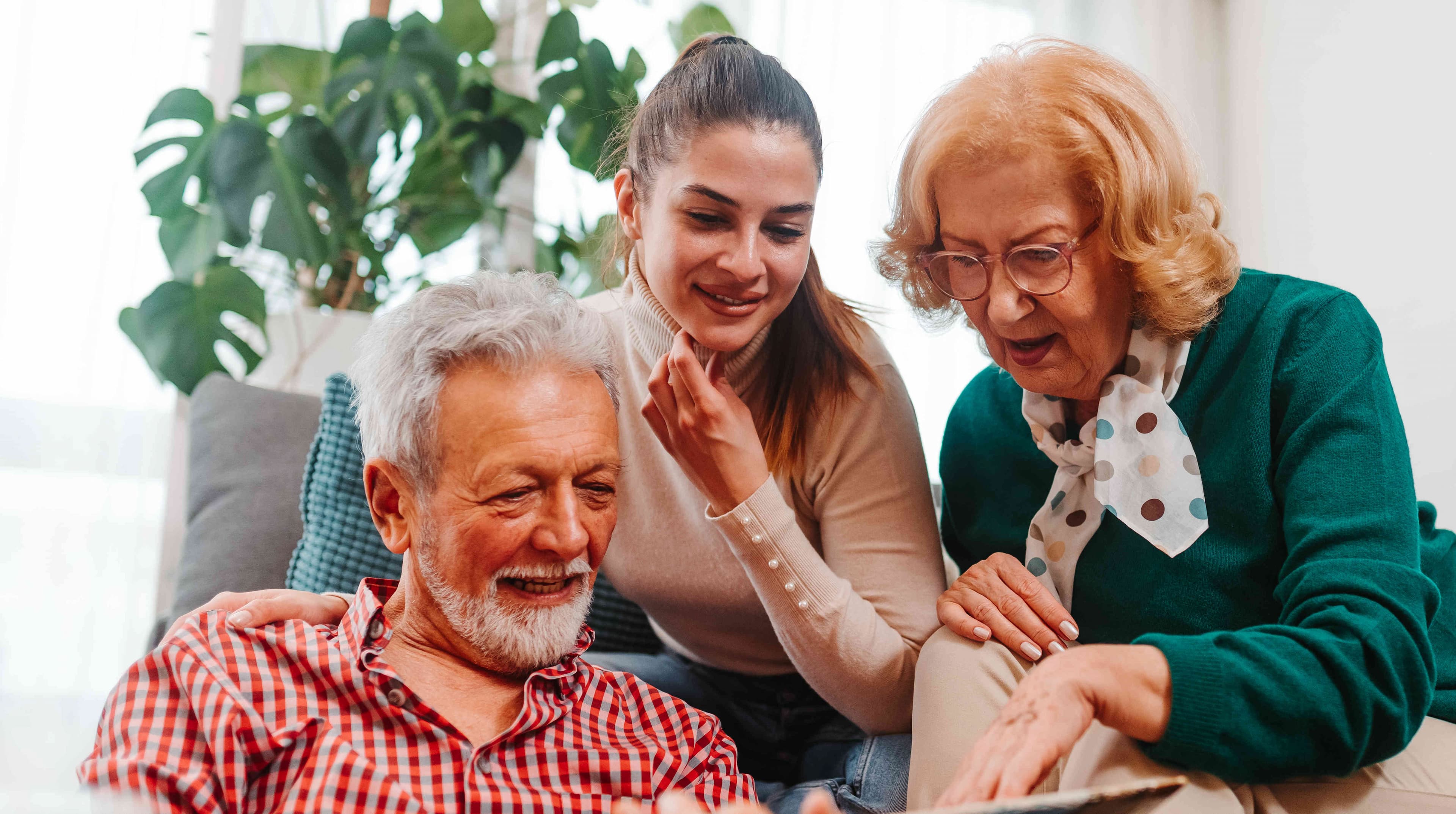 Image of a multigenerational group using tablet computer.